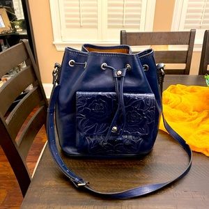 All leather draw string purse. Hardly used  very roomy. Zipper pocket. 2 areas